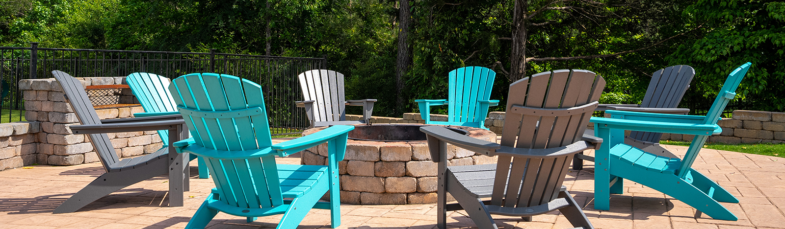 fire pit surrounded by lounge chairs